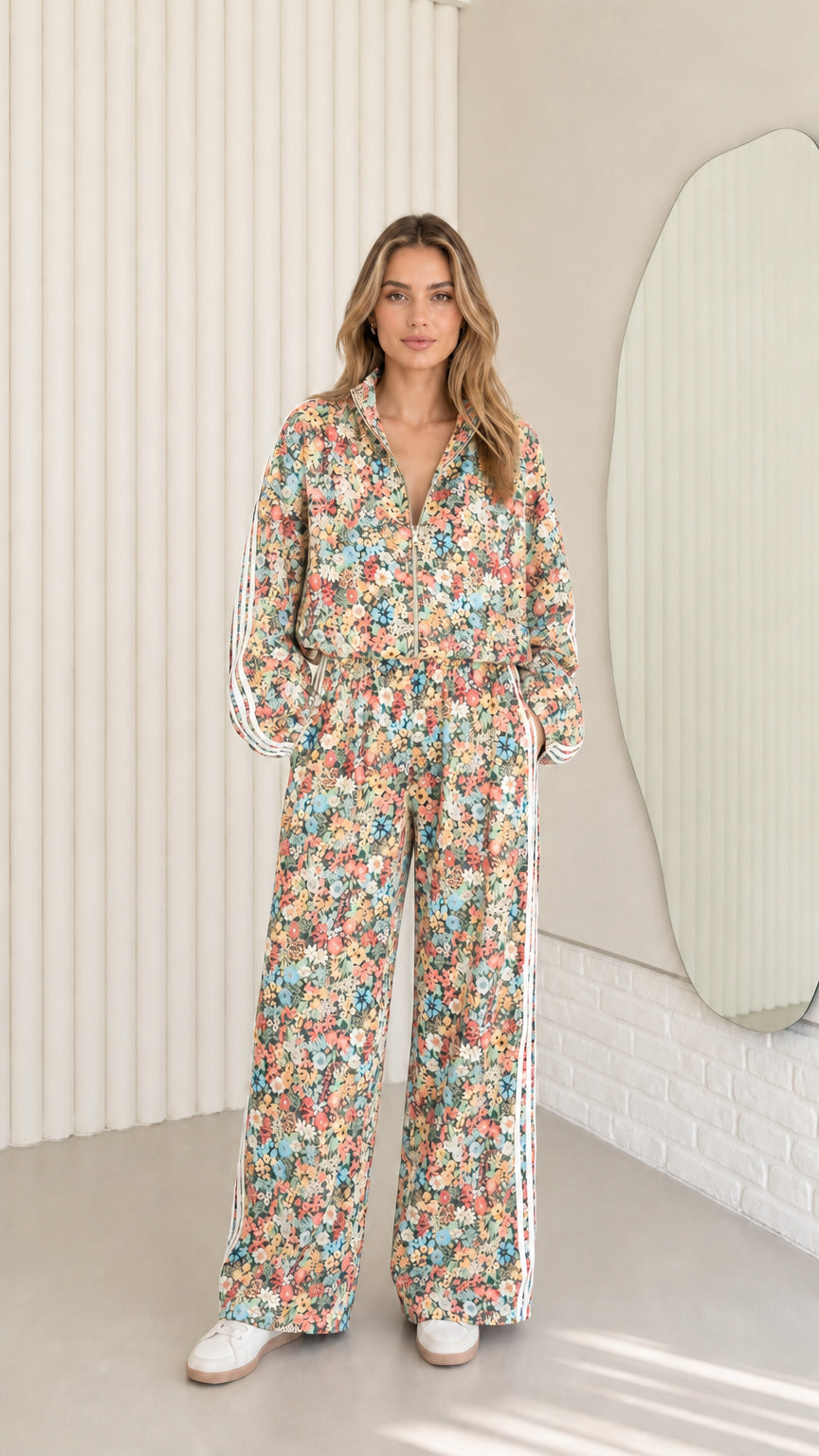 Woman wearing cream beige floral print zip-up tracksuit two-piece set
