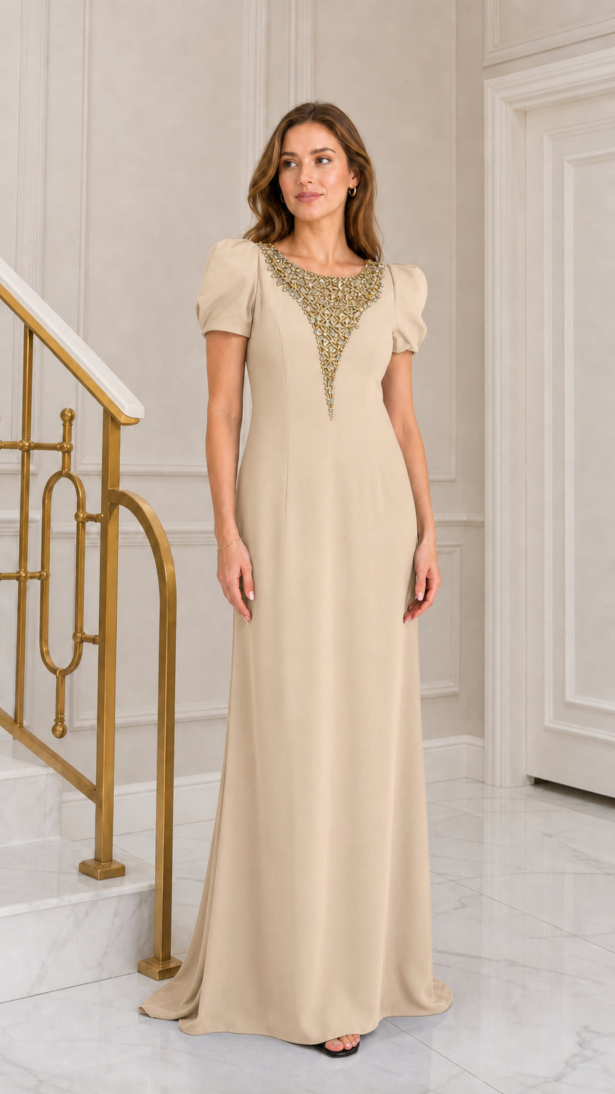 Front view of woman wearing champagne beige crystal embellished puff sleeve formal maxi dress