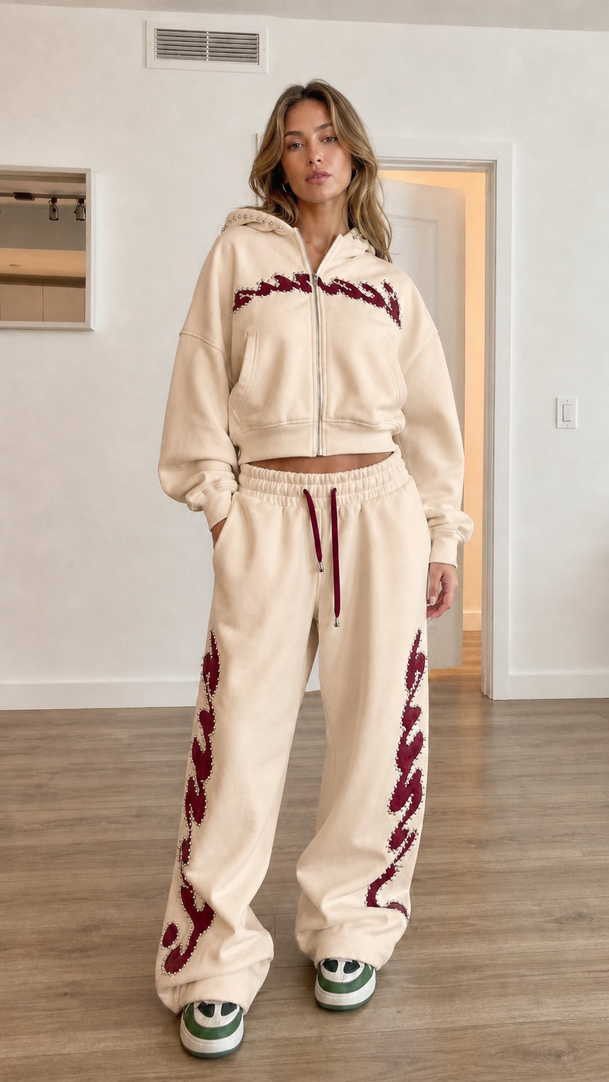 Model wearing beige cropped zip hoodie and wide leg sweatpants set