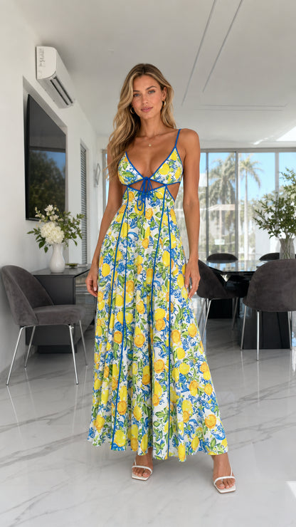 Front view of model wearing white Mediterranean lemon print cutout maxi dress