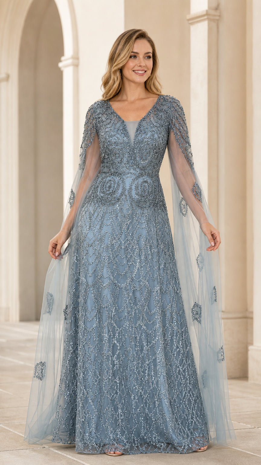Dusty blue beaded evening gown with matching sheer tulle cape front view