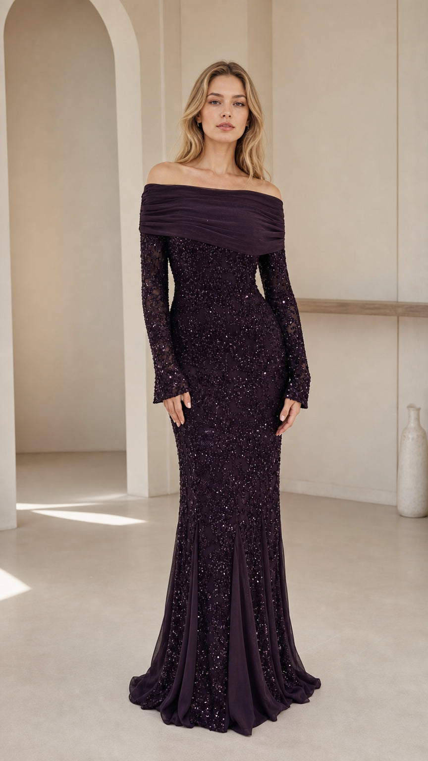 Front view of a woman wearing a plum off-shoulder sequin mermaid gown