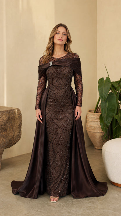 Full front view of model wearing Chocolate Brown sequin evening gown with draped satin overskirt