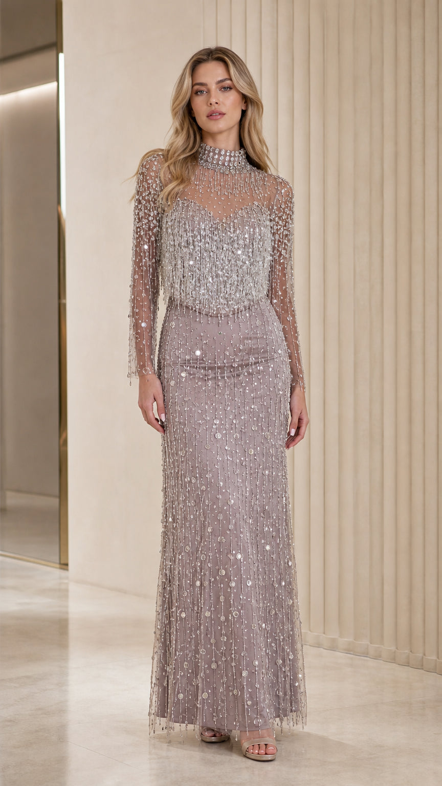 Front view of model wearing mauve beaded long sleeve evening gown