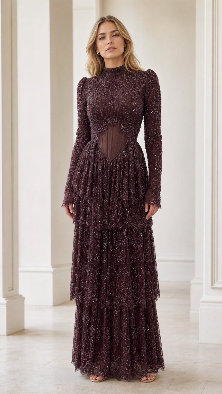 Front view of model wearing burgundy long sleeve embellished corset tiered evening maxi dress