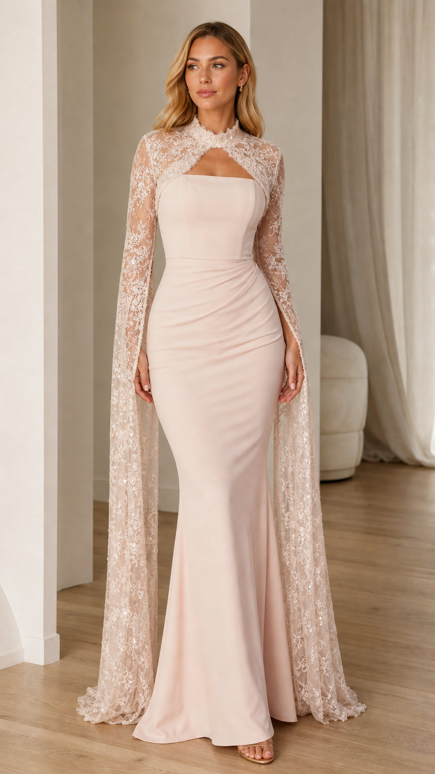 Front view of blush pink lace cape sleeve evening gown