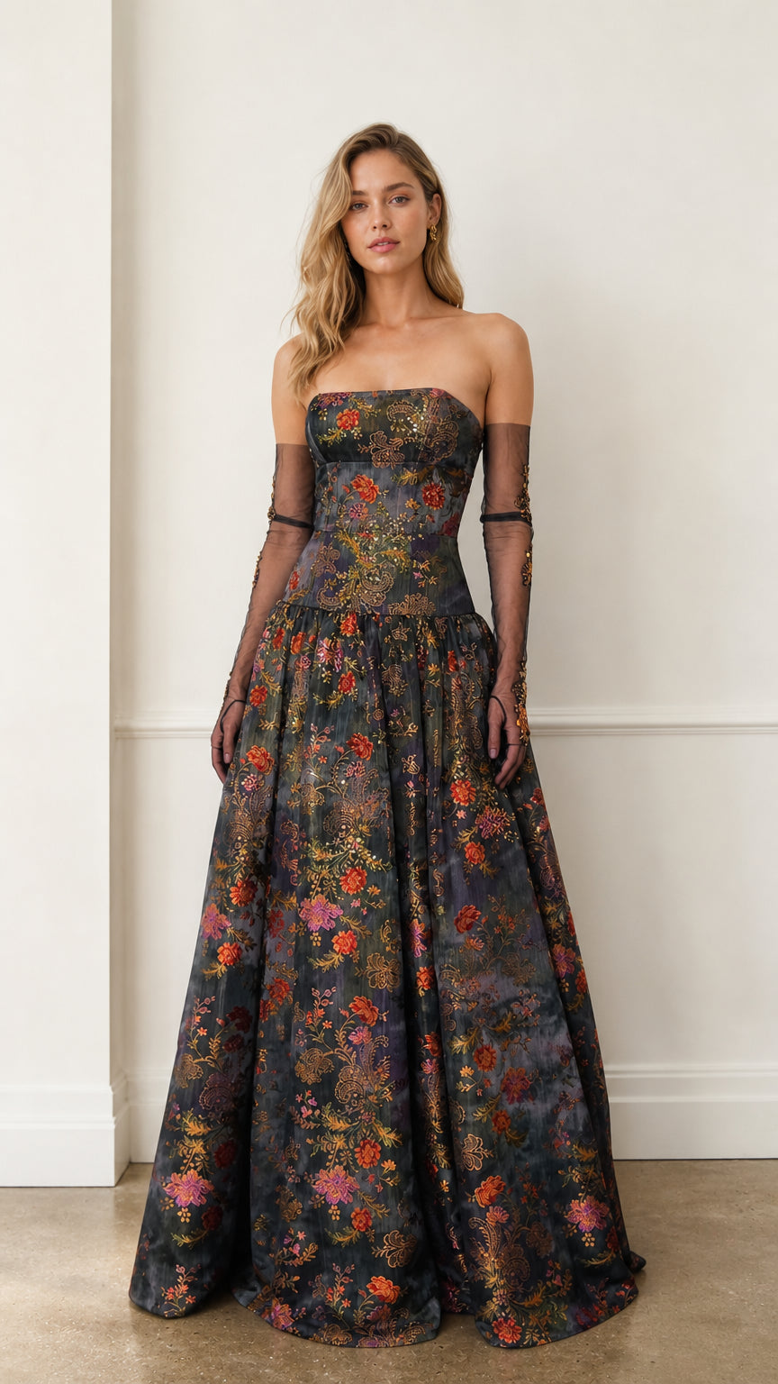 Front view of charcoal floral strapless evening gown with sheer sleeves