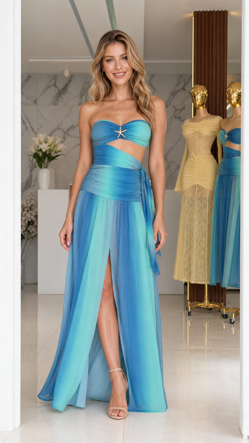 Model wearing blue ombre strapless cutout long dress front view