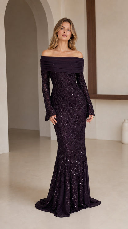 Model wearing dark plum off-shoulder sequin mermaid evening gown, front view