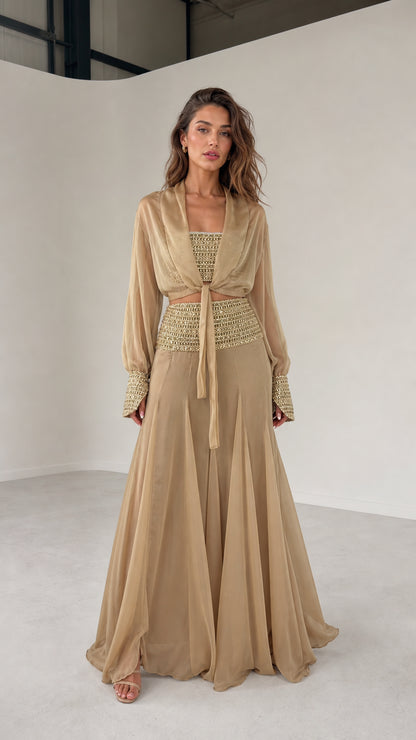 Front view of model wearing champagne three-piece chiffon set
