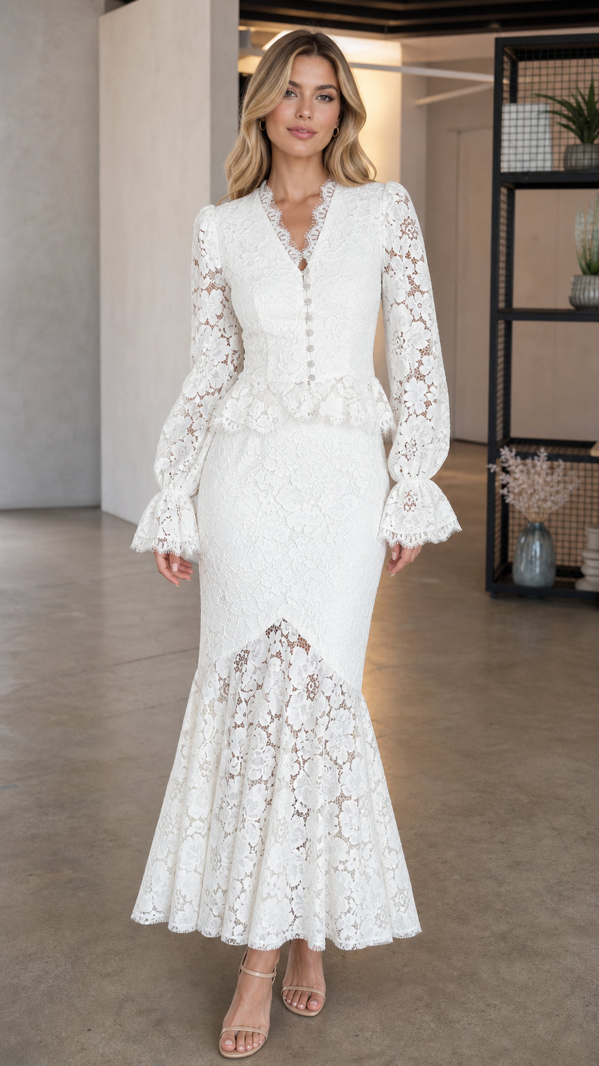 Front view of model wearing white long-sleeve lace peplum mermaid maxi dress