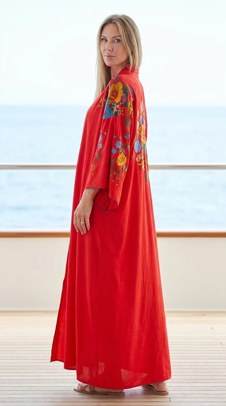 Model wearing red floral embroidered maxi kaftan dress, side view