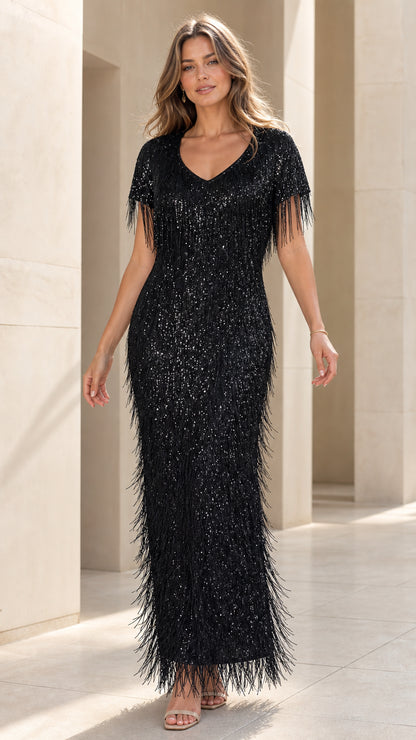 Front view of model wearing black sequin fringe evening dress