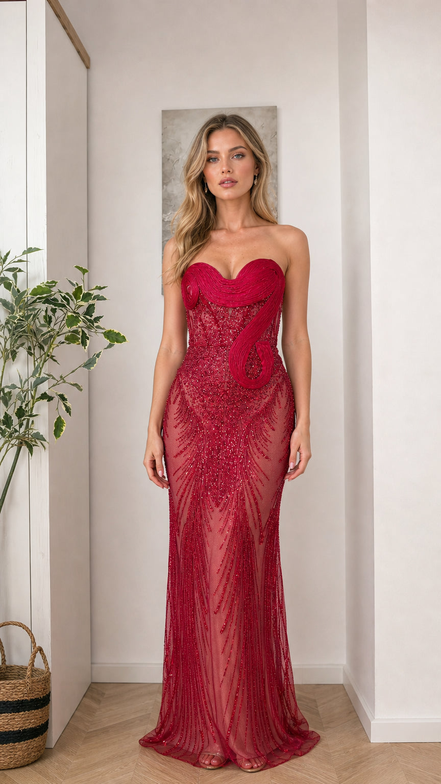 Front view of woman wearing red strapless beaded evening gown