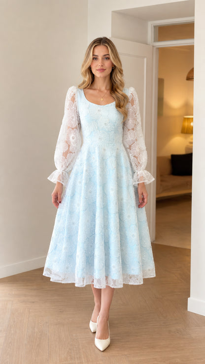 Front view of model wearing light baby blue embroidered long sleeve A-line midi dress