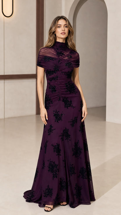 Model wearing plum high-neck beaded evening dress front view