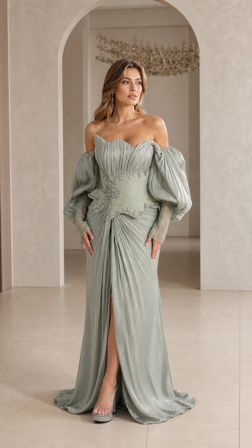 Front full-length view of model in Sage Green off-the-shoulder pleated evening gown with beaded basque waist