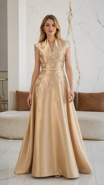 Front view of model wearing champagne gold embroidered satin evening gown