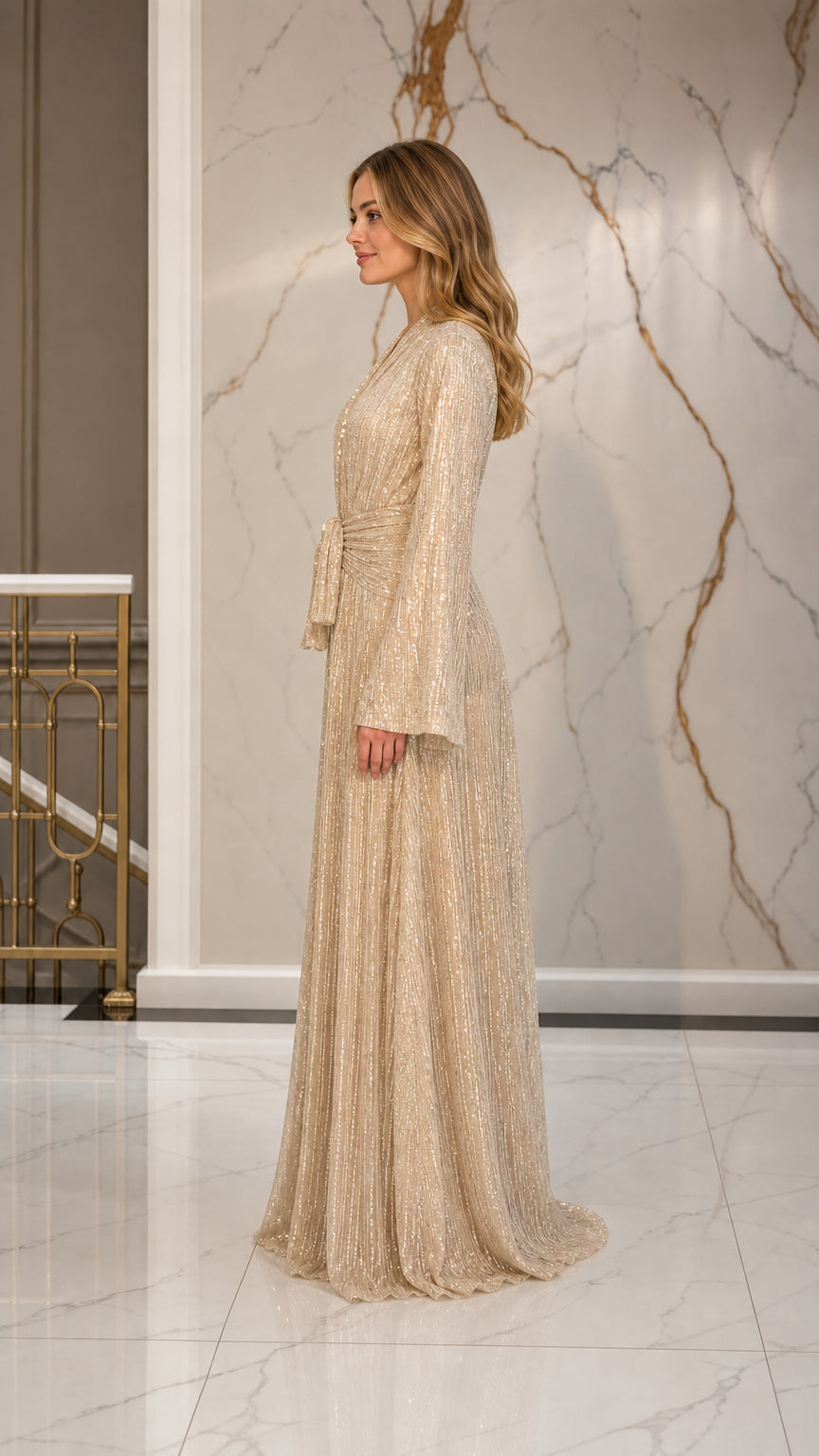Champagne pleated evening gown side view showcasing elegant drape
