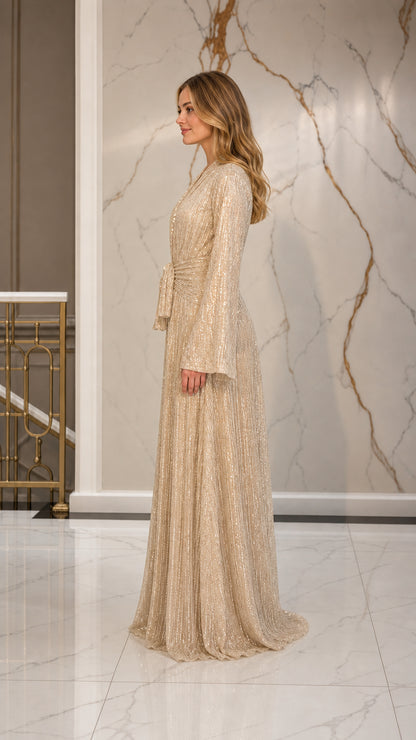 Champagne pleated evening gown side view showcasing elegant drape
