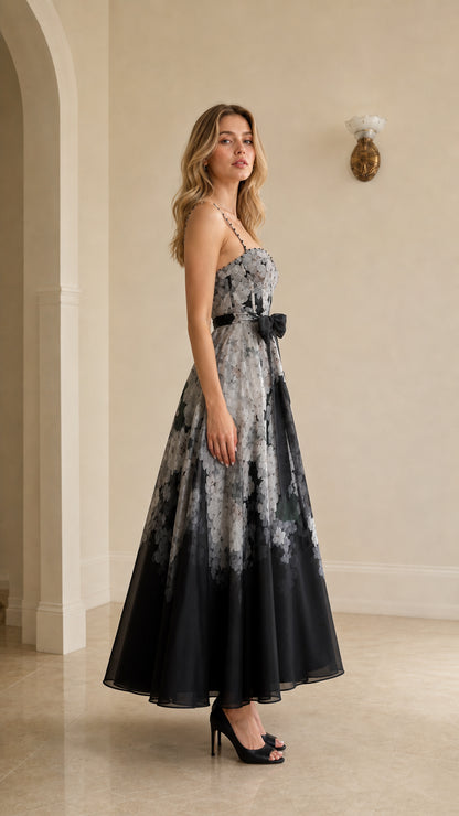 Side profile view of black floral ombre maxi dress