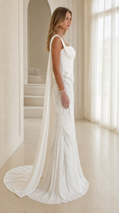 Side profile of white formal evening dress with cape detail