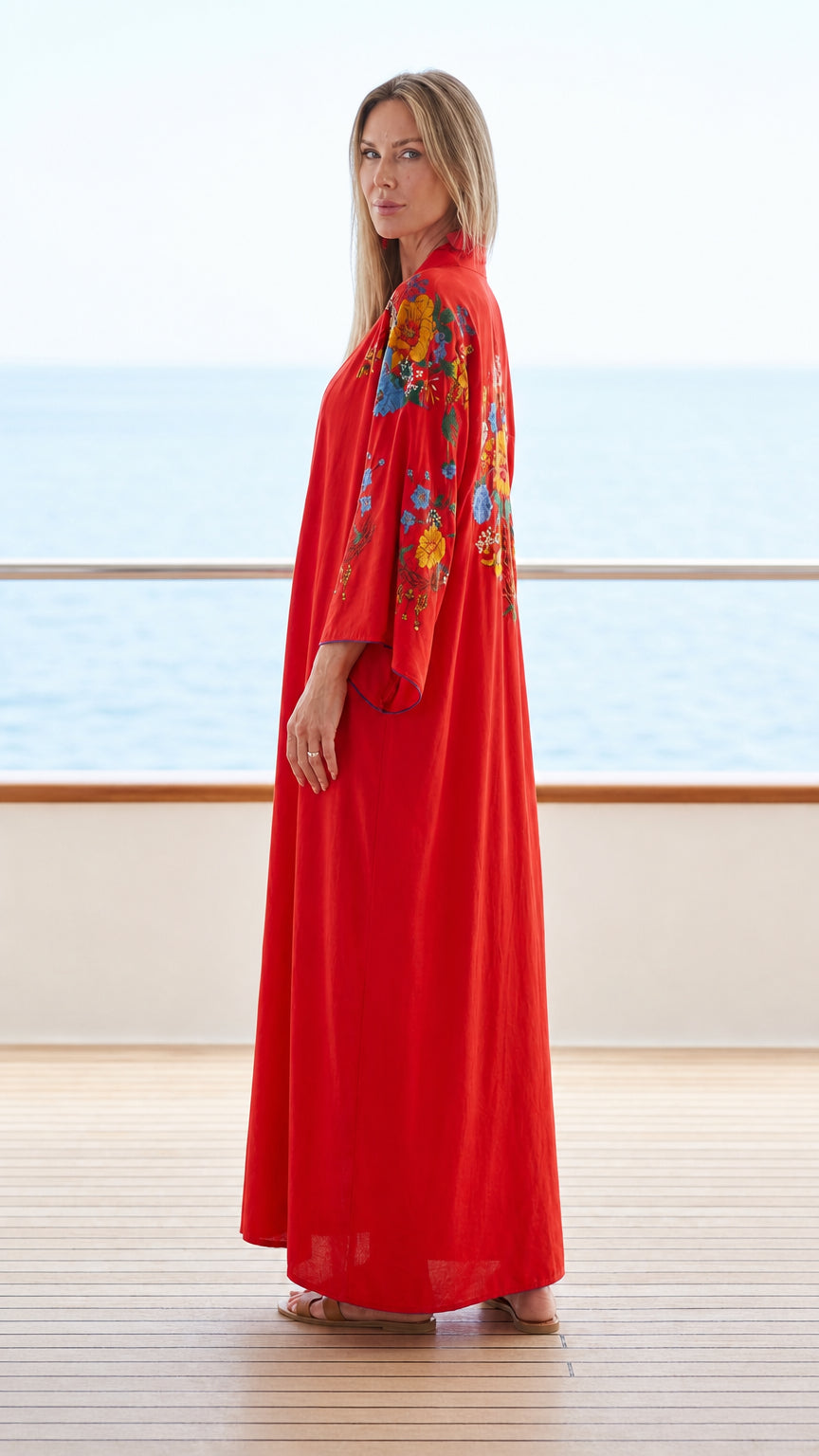 Full length view of red kaftan dress on resort balcony