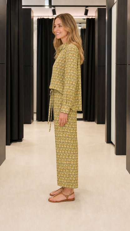 Side profile view of woman in olive matching set