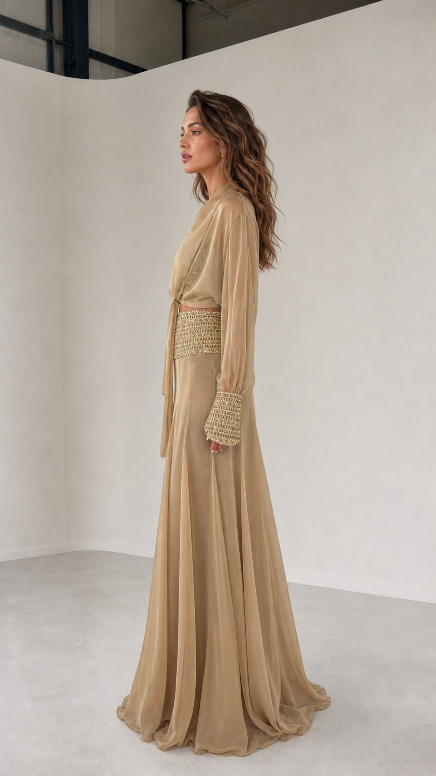 Side view of model wearing champagne three-piece chiffon set