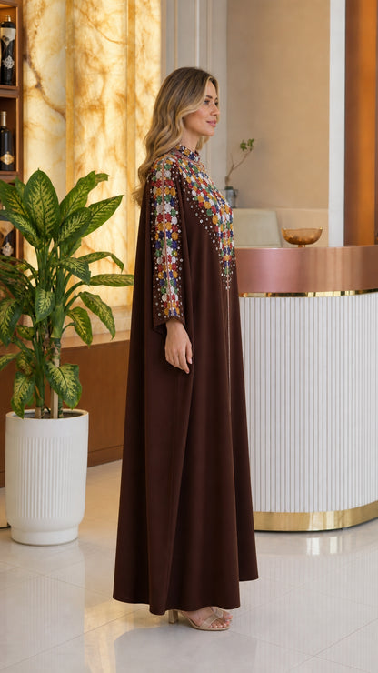 Side profile view of chocolate brown flowing modest kaftan dress with beaded collar