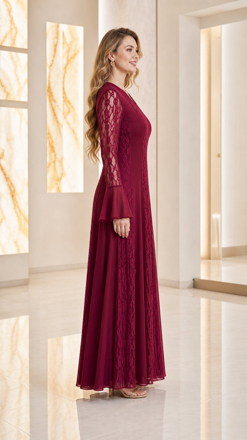 Side profile view of woman wearing burgundy A-line lace evening gown