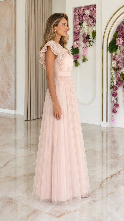 Side profile view of blush pink one-shoulder tulle evening dress