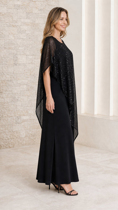 Side-angle view of model in black sequined capelet maxi dress showing draped poncho detail