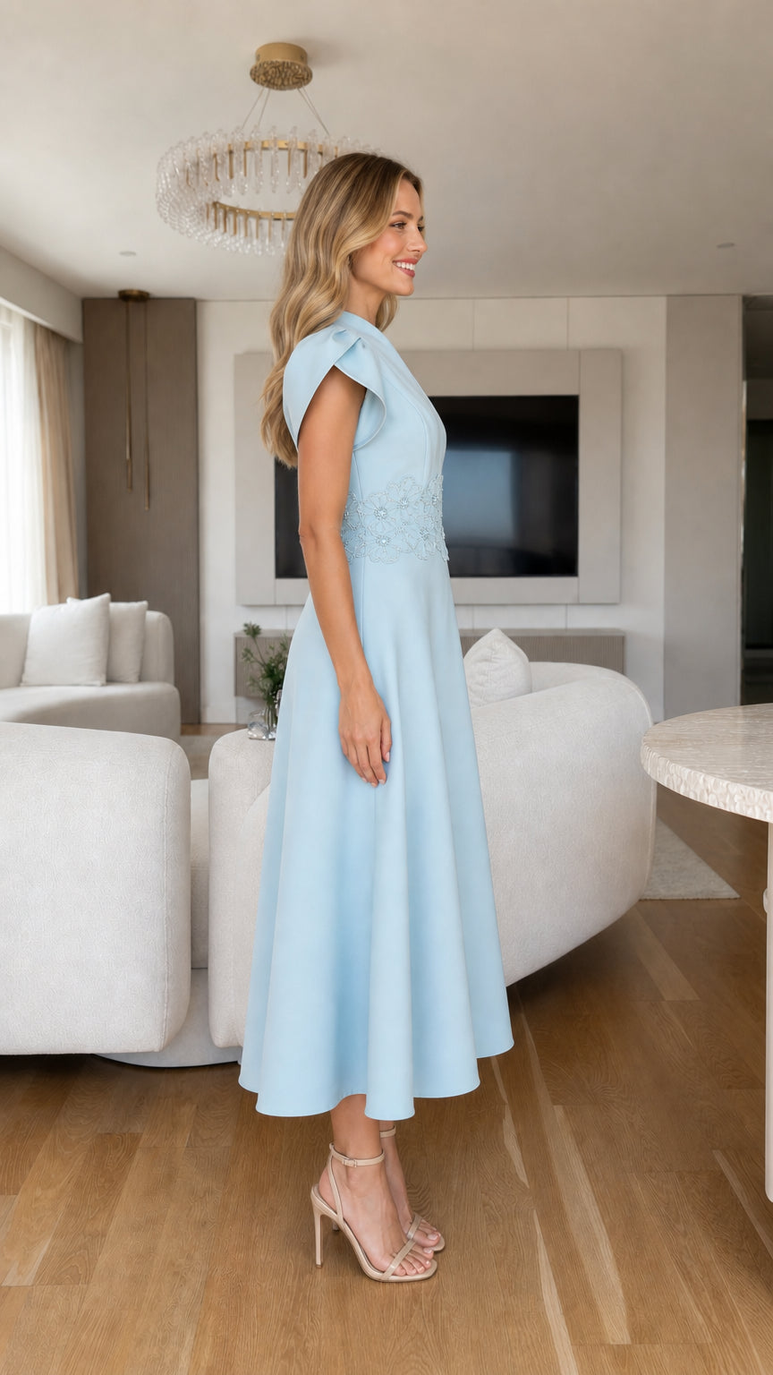 Side profile view of light blue tulip sleeve midi dress