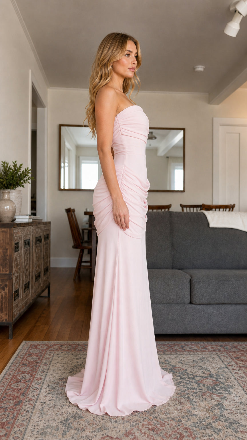 Side profile view of the blush pink evening gown showcasing the silhouette