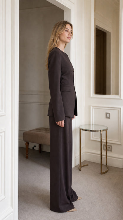 Side profile view of dark brown trouser suit