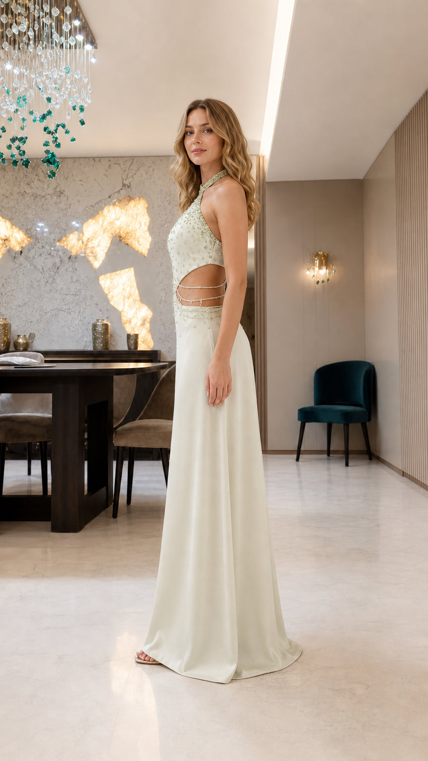 Side profile view of model in sage green formal gown