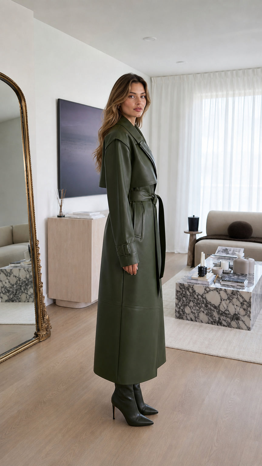 Side profile of woman in olive green faux leather trench coat