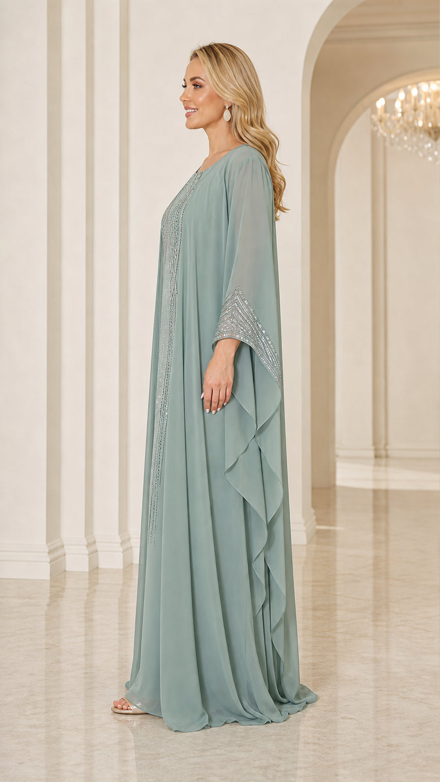 Side profile view of sage green flowy cape dress showing sleeve drape