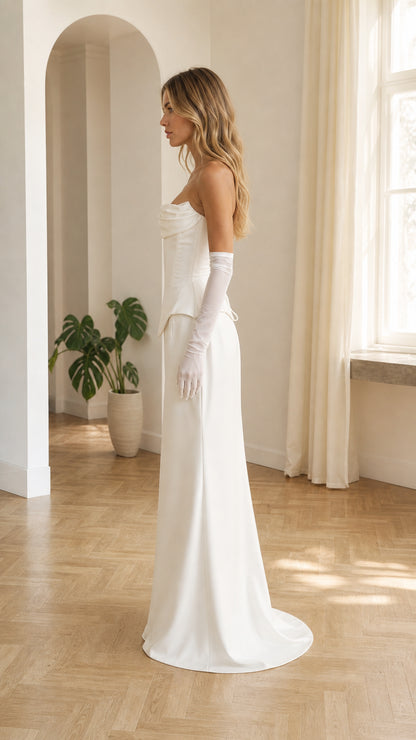 Side profile view of white strapless corset maxi dress