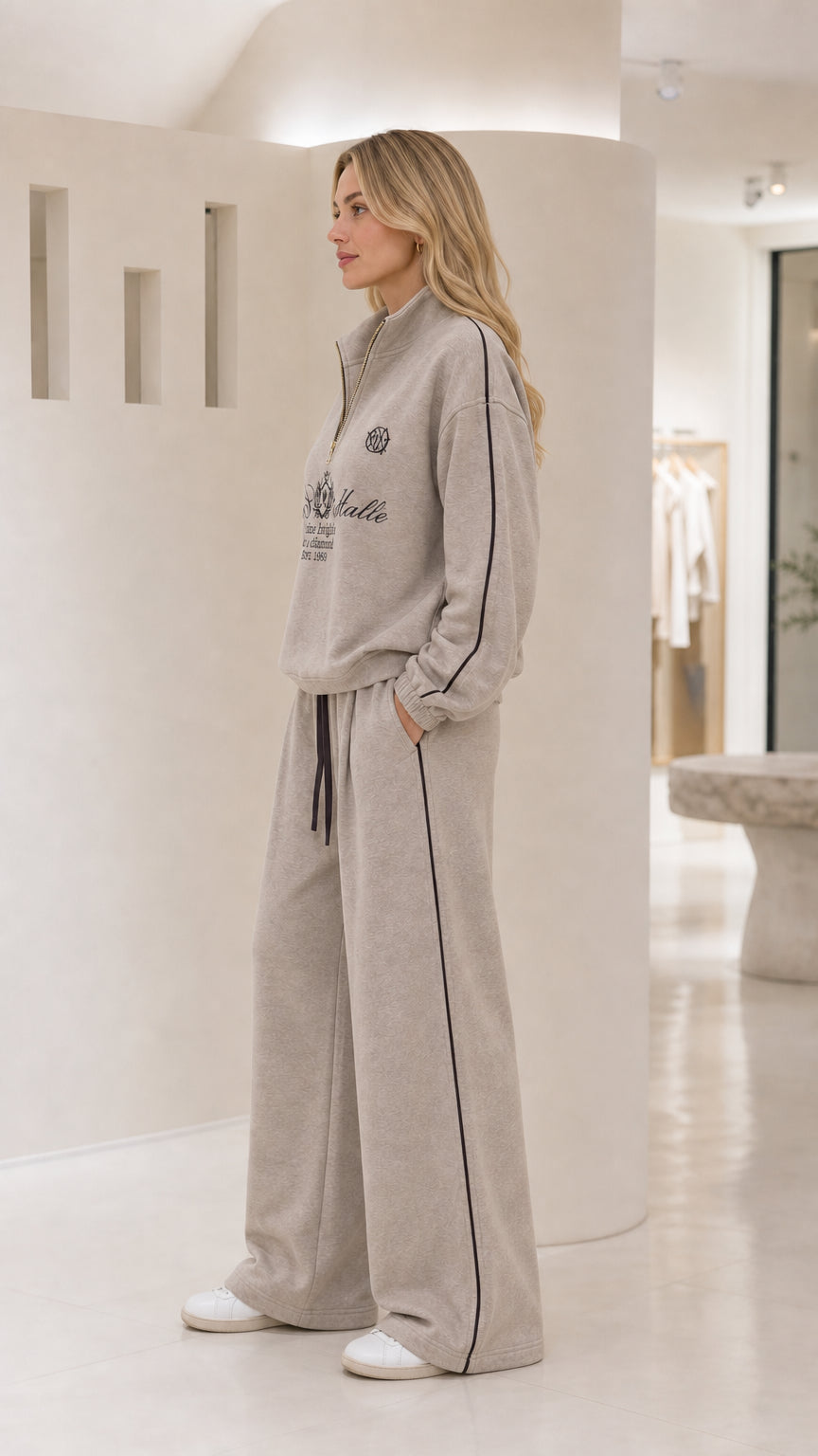 Side view of the taupe women's quarter-zip tracksuit set