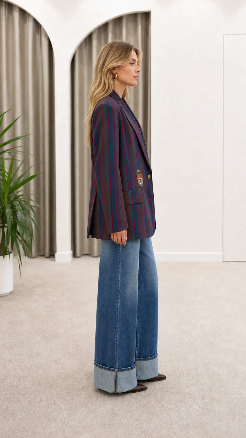 Model wearing Navy Multicolor striped collegiate blazer - side angle view