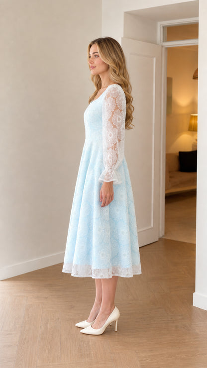 Side profile view of light baby blue floral embroidered cocktail dress