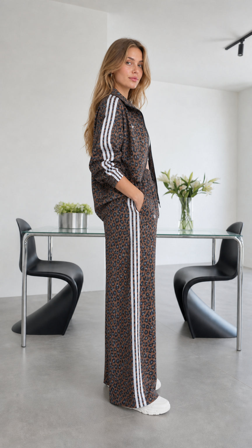Side view of model in brown leopard print tracksuit