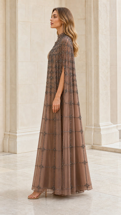 Side profile view of taupe beaded cape gown