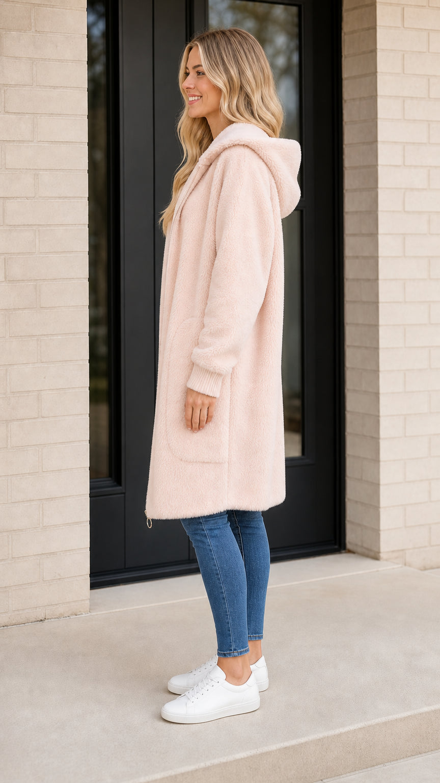 Side profile view of light pink fleece coat