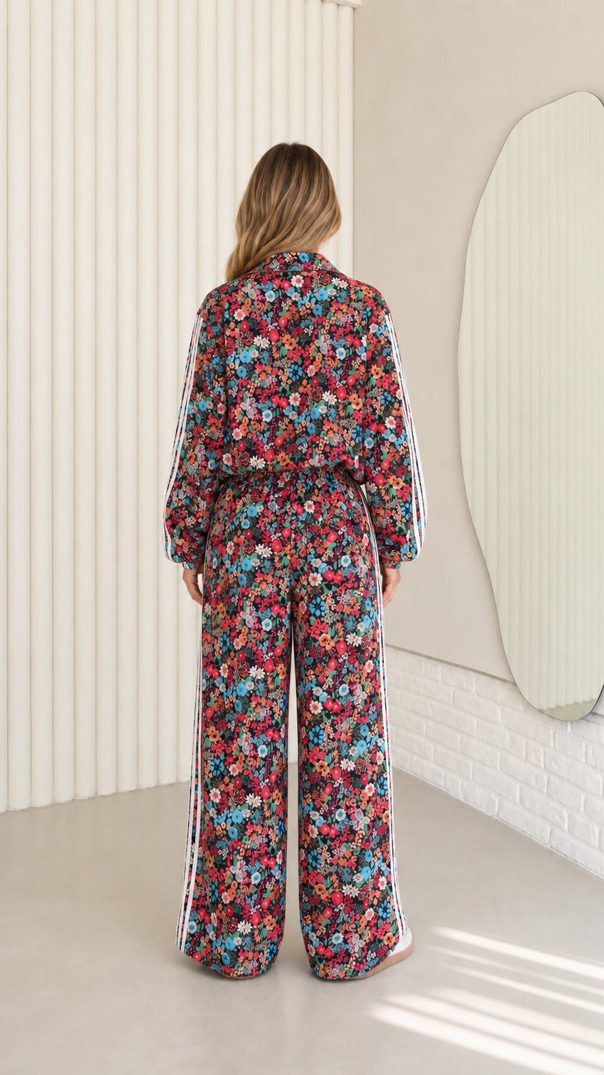 Back view of woman wearing floral print two-piece loungewear tracksuit set