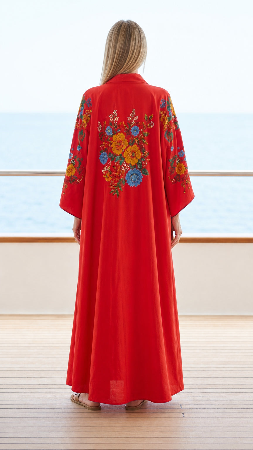 Back view of red kaftan showing floral back embroidery