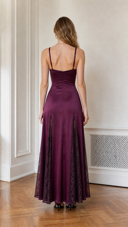 Model wearing plum satin dress back view
