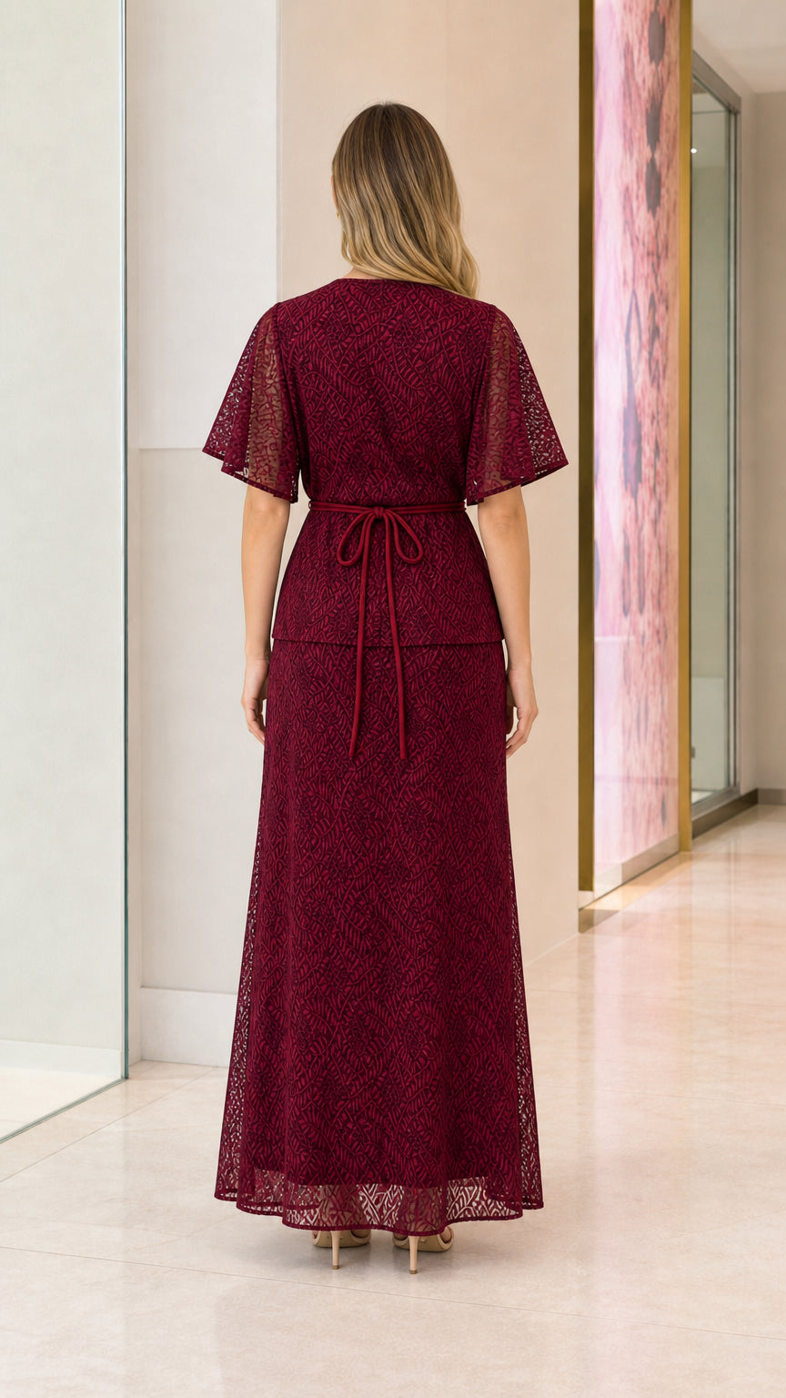 Back view of model in burgundy lace maxi dress